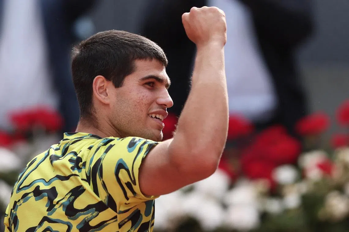 Spain's Carlos Alcaraz celebrates beating Russian Karen Khachanov.