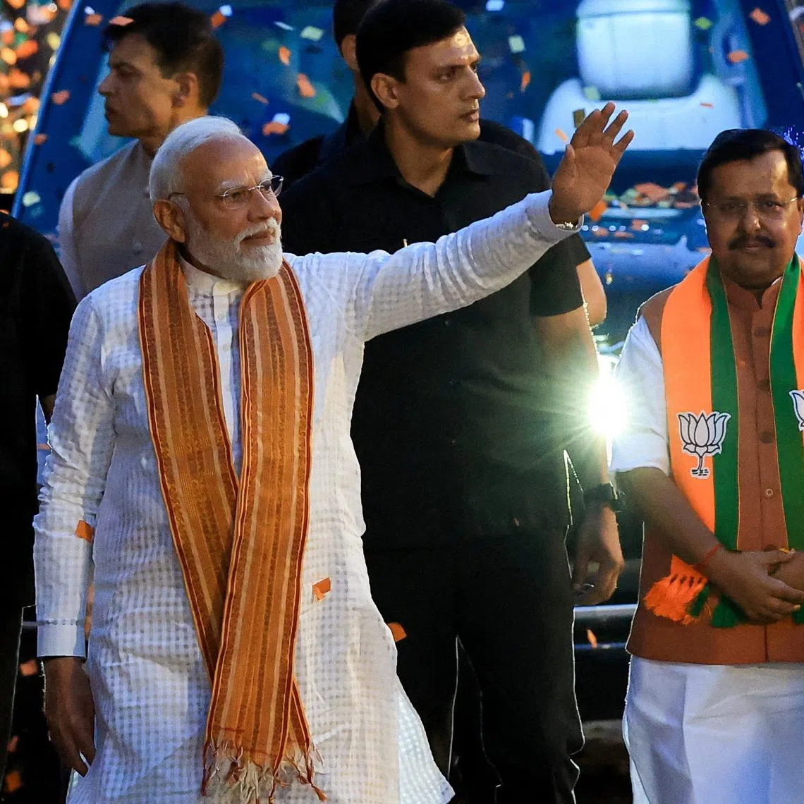 India's Prime Minister Narendra Modi greets his supporters as he arrives at the Bharatiya Janata Party (BJP) headquarters in New Delhi, India, May 4, 2026. REUTERS/Adnan Abidi/File Photo