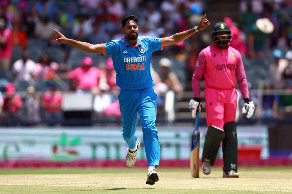 Cricket - First One Day International - South Africa v India - Wanderers Stadium, Johannesburg, South Africa - December 17, 2023 India's Avesh Khan celebrates after taking the wicket of South Africa's David Miller, caught out by KL Rahul REUTERS/Siphiwe Sibeko