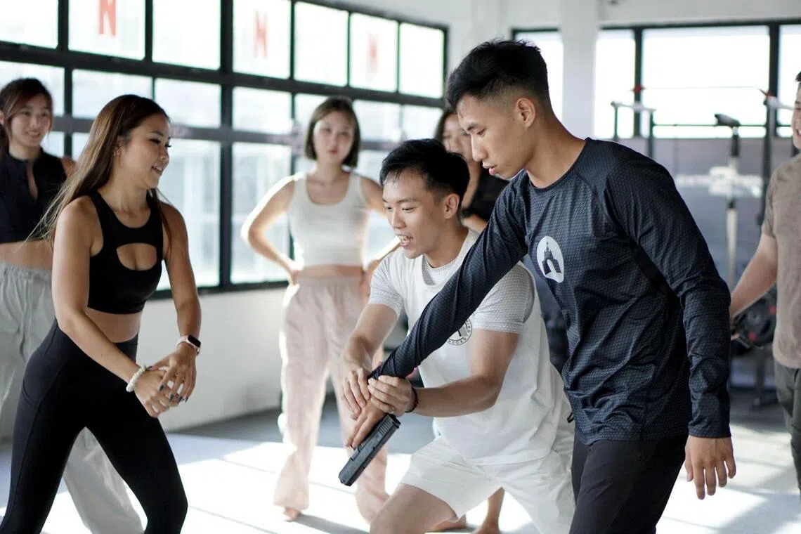 shsandbox19 - Founder of Sandbox Training Ground Peps Goh (centre, in white) says he is mulling closure and bankruptcy of the local stunt school. 
PHOTO: REMUS KOH