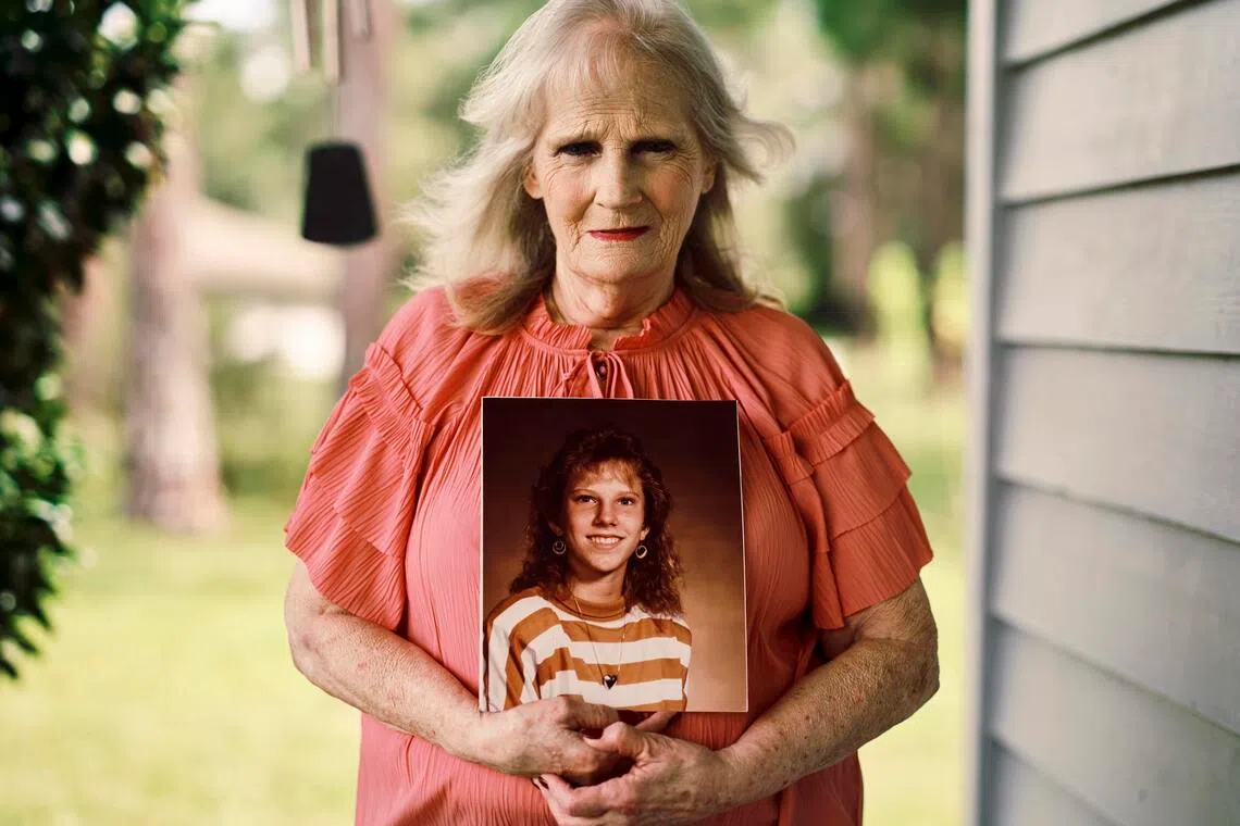 May Martinez holding a photo of her daughter, Colleen Slemmer, at her home in Palatka, Florida, in September 2026.