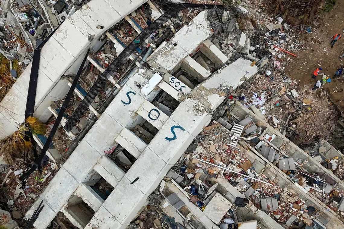 An aerial view taken on July 2 in Caraballeda in the Venezuelan state of La Guaira shows collapsed buildings following the June 24 twin earthquakes.