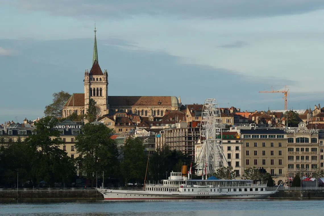 FILE PHOTO: The St. Pierre Cathedral is seen early morning near Lake Leman in Geneva, Switzerland May 27, 2019. REUTERS/Denis Balibouse/File photo