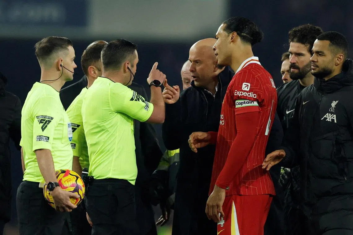 Liverpool manager Arne Slot remonstrating with referee Michael Oliver before being sent off, during Liverpool's match against Everton on Feb 12.