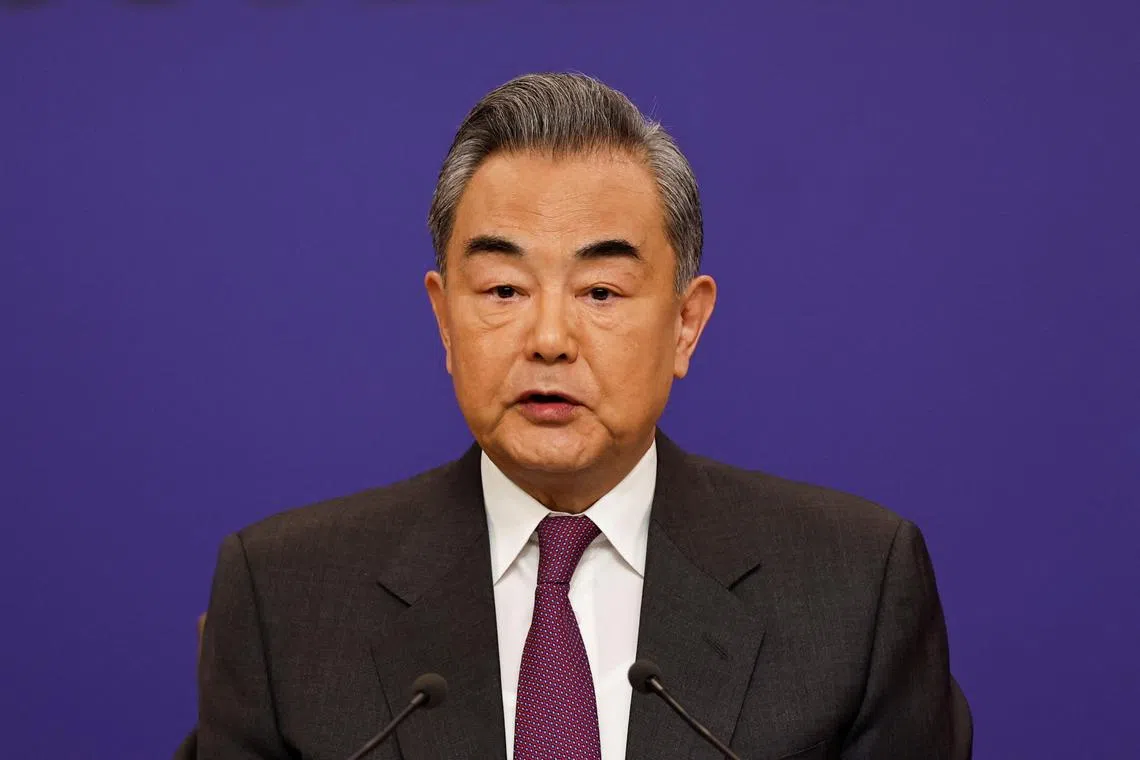 FILE PHOTO: Chinese Foreign Minister Wang Yi attends a press conference on the sidelines of the National People's Congress (NPC), in Beijing, China March 7, 2024. REUTERS/Tingshu Wang/File Photo