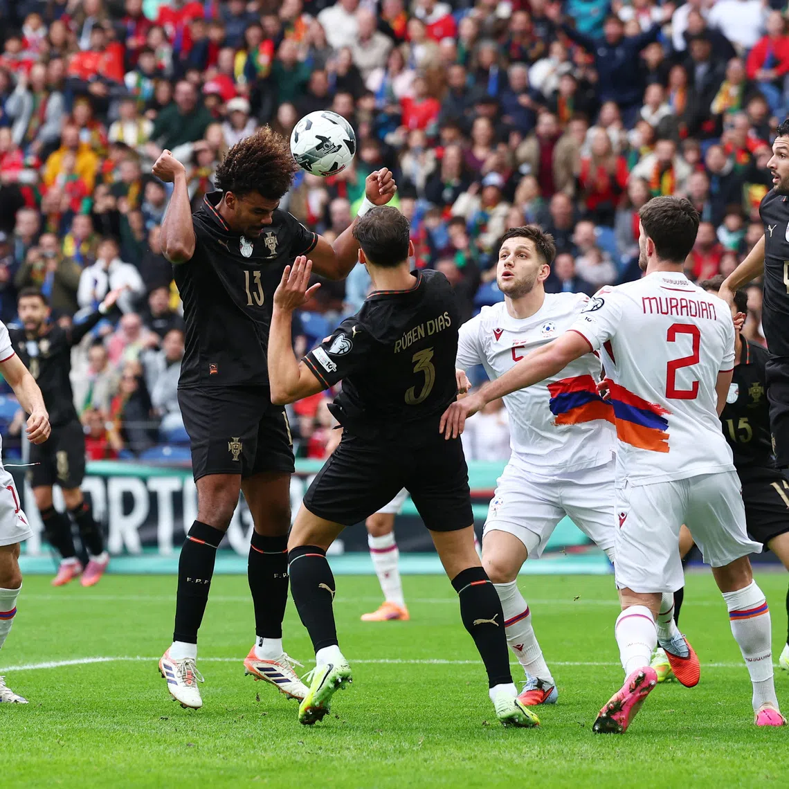 Soccer Football - World Cup - UEFA Qualifiers - Group F - Portugal v Armenia - Estadio do Dragao, Porto, Portugal - November 16, 2025 Portugal's Renato Veiga scores their first goal REUTERS/Pedro Nunes
