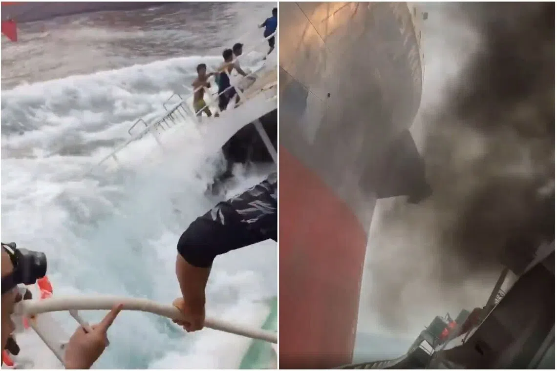 Waves wash across the deck of the Chinese fishing vessel as black smoke billows from it.