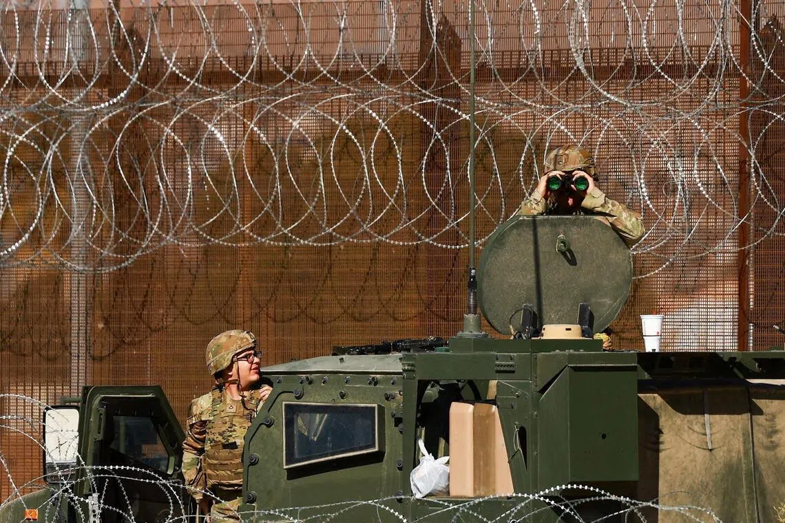 US military personnel conducting surveillance near the border wall between the United States and Mexico on Jan 12.