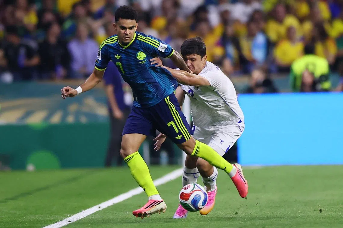 Soccer Football - FIFA World Cup 2026 - Group K - Uzbekistan v Colombia - Estadio Azteca, Mexico City, Mexico - June 17, 2026 Colombia's Luis Diaz in action with Uzbekistan's Abdukodir Khusanov REUTERS/Eloisa Sanchez