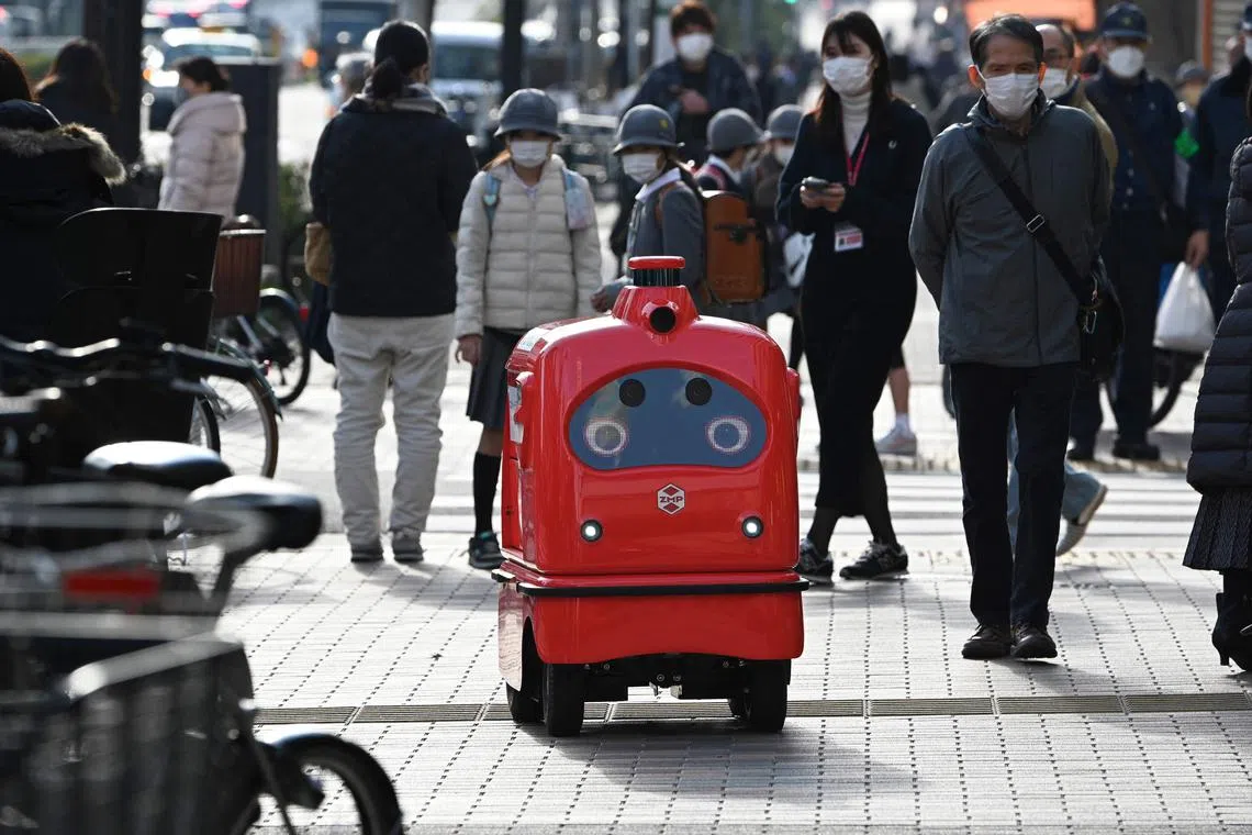The “DeliRo” robot aims for a charming look, featuring big, expressive eyes that can be made teary in sadness if pedestrians block its way. 