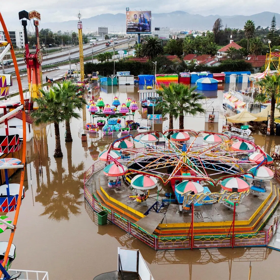 A drone view shows a flooded amusement park after heavy rainfall from a weather front caused flooding and led the Chilean authorities to declare a state of emergency, in La Serena, Chile, July 20, 2026. REUTERS/Jorge Vega