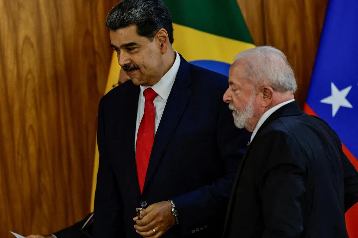 FILE PHOTO: Venezuela's President Nicolas Maduro and Brazil's President Luiz Inacio Lula da Silva stand before a summit with presidents of South America to discuss the re-launching of the regional cooperation bloc UNASUR, in Brasilia, Brazil, May 29, 2023. REUTERS/Ueslei Marcelino/File Photo