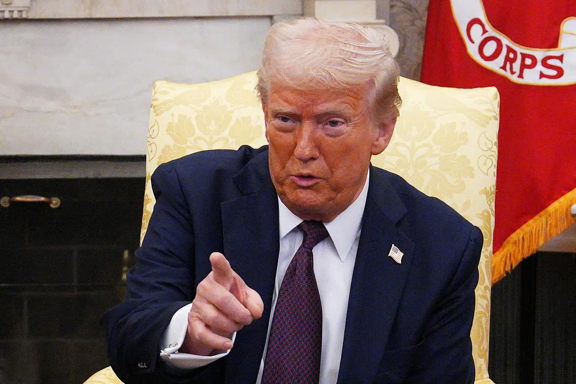 U.S. President Donald Trump gestures during a meeting with British Prime Minister Keir Starmer in the Oval Office at the White House on February 27, 2025 in Washington, D.C., U.S. Carl Court/Pool via REUTERS
