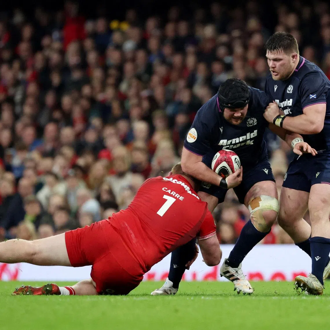Rugby Union - Six Nations Championship - Wales v Scotland - Principality Stadium, Cardiff, Wales, Britain - February 21, 2026 Scotland's Gregor Brown in action with Wales' Rhys Carre REUTERS/Cat Goryn