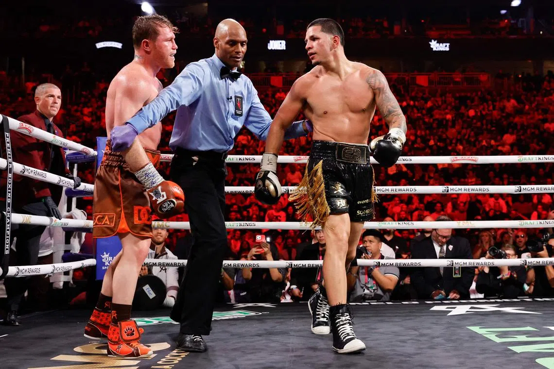 Referee Harvey Dock separates Canelo Alvarez and Edgar Berlanga at the end of the 11th round during their title fight at T-Mobile Arena on Sept 14, 2024 in Las Vegas.