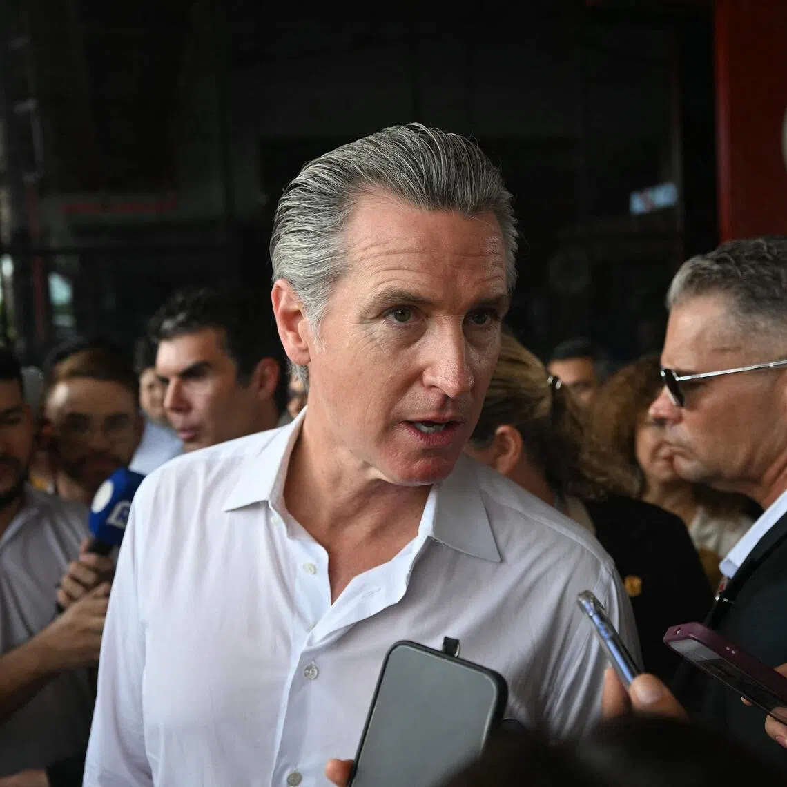 California Governor Gavin Newsom answering questions on the sidelines of the COP30 climate conference in Belem, Brazil, on Nov 11.