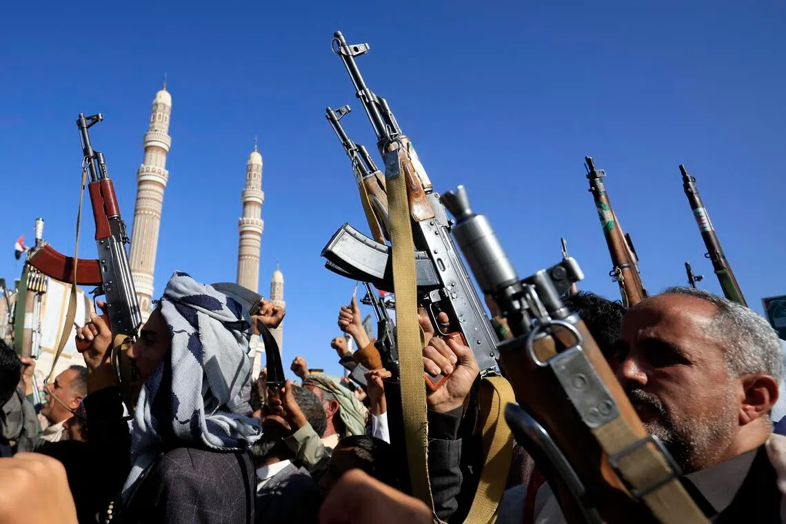 Supporters of Yemen’s Iran-backed Houthi militants holding up weapons during a protest against Saudi Arabia, in Sana’a, Yemen, on Oct 9. Yemen’s Houthis have escalated their strikes against the kingdom.