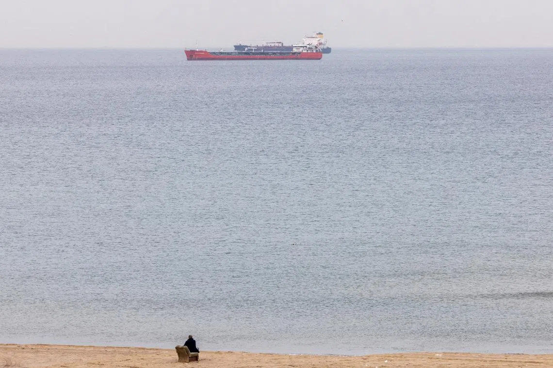 FILE PHOTO: Commercial vessels, including oil tankers, wait at an anchorage in the Black Sea off Kilyos near Istanbul, Turkey, December 9, 2022. REUTERS/Umit Bektas/File Photo