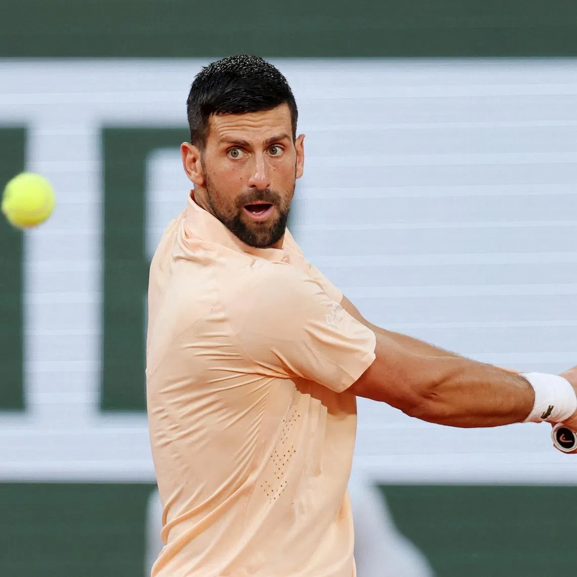 Tennis - French Open - Roland Garros, Paris, France - May 24, 2026  Serbia's Novak Djokovic in action during his first round match against France's Giovanni Mpetshi Perricard. REUTERS/Stephane Mahe