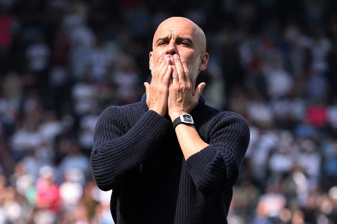 FILE PHOTO: Soccer Football - Premier League - Fulham v Manchester City - Craven Cottage, London, Britain - May 11, 2024 Manchester City manager Pep Guardiola celebrates after the match REUTERS/David Klein/File Photo