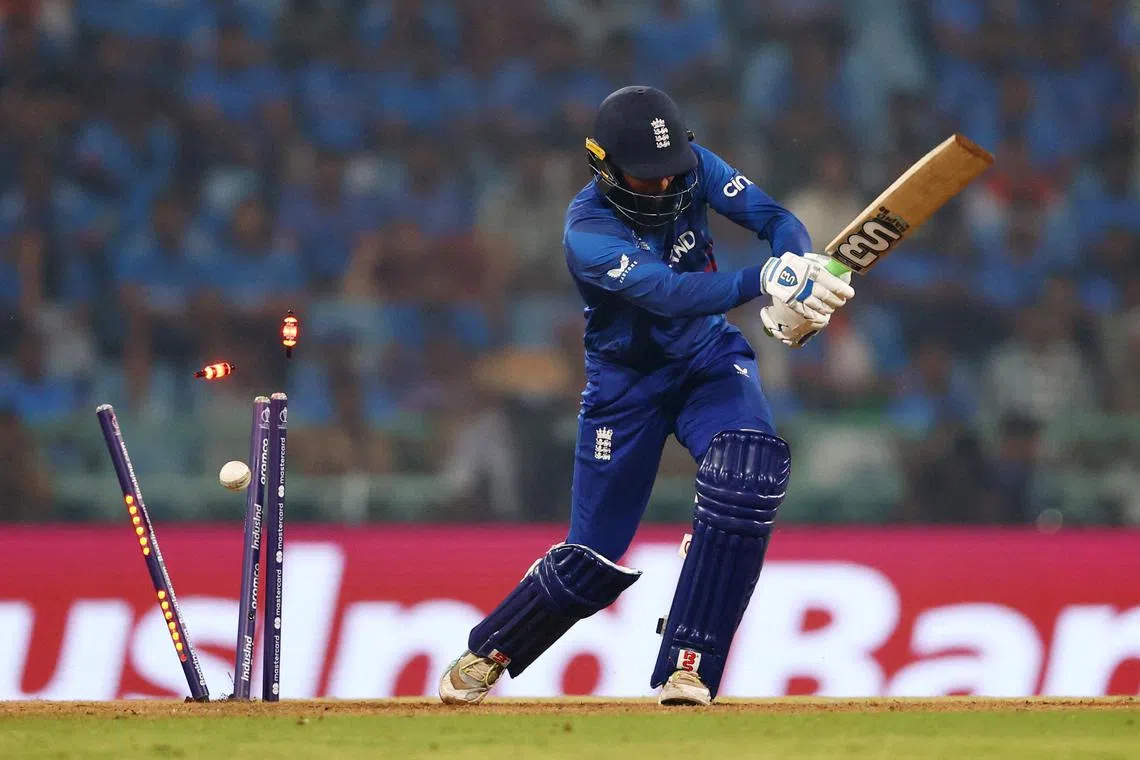 England's Adil Rashid being bowled out by India's Mohammed Shami during the Cricket World Cup defending champions' 100-run thrashing by India on Sunday.