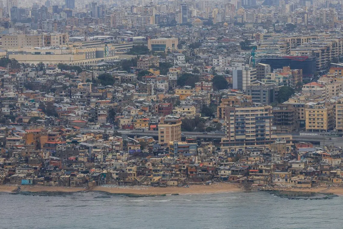 An aerial view from the window of a Lebanese Middle East Airlines (MEA) airplane show part of the city of Beirut, Lebanon, April 7, 2026. REUTERS/Louisa Gouliamaki