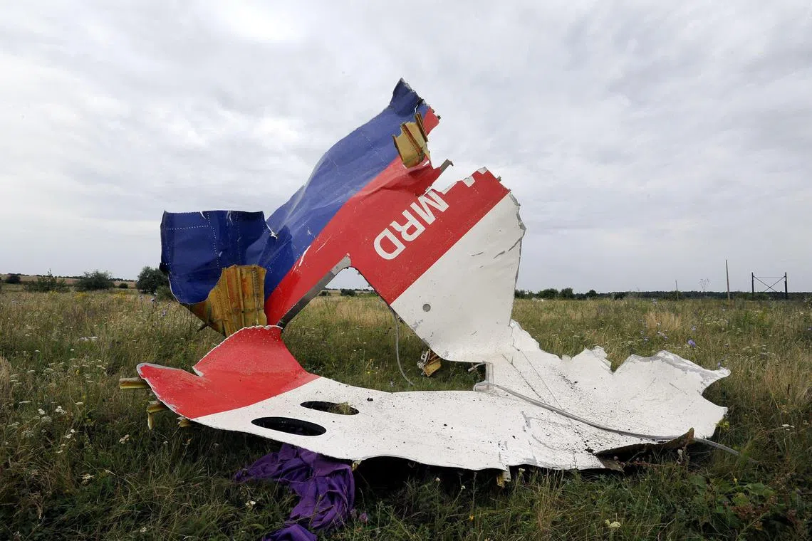 A 2014 photo showing wreckage of  Malaysia Airlines flight MH17 lying in a field in eastern Ukraine.