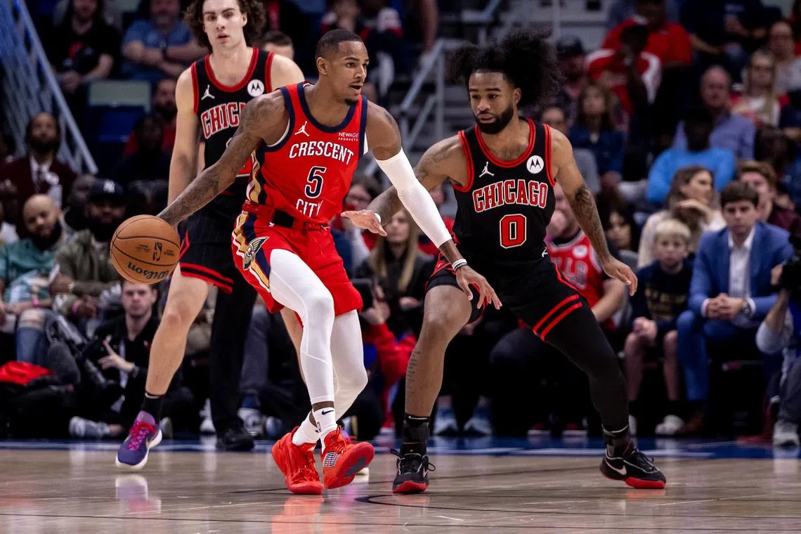 Oct 23, 2024; New Orleans, Louisiana, USA;  New Orleans Pelicans guard Dejounte Murray (5) dribbles against Chicago Bulls guard Coby White (0) during the first half at Smoothie King Center. Mandatory Credit: Stephen Lew-Imagn Images/ File Photo