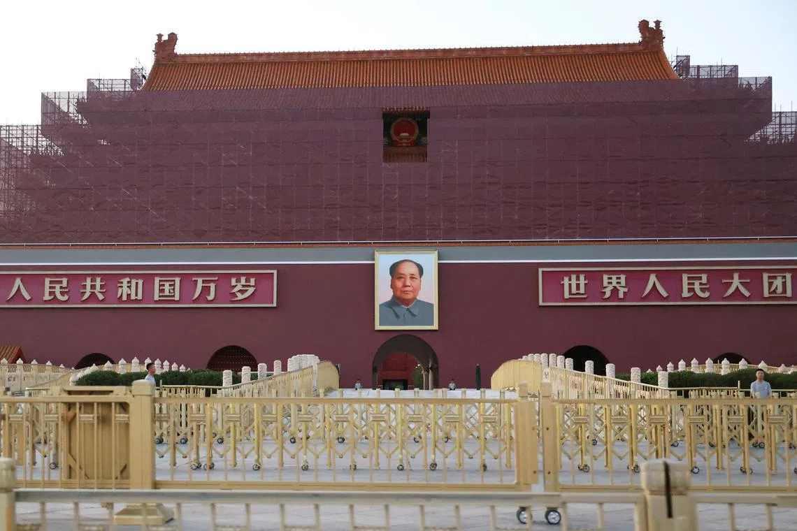 Security personnel keep watch near the portrait of late Chinese Chairman Mao Zedong displayed on the Tiananmen Gate, in Beijing, China June 3, 2025. REUTERS/Florence Lo