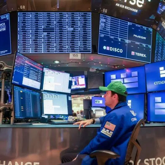 A trader works on the floor of the New York Stock Exchange in New York on Dec 8.