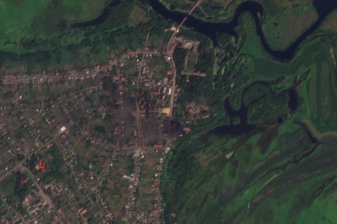 FILE PHOTO: View of smoke rising from buildings that were purportedly struck by Ukrainian forces, amid their ongoing incursion, in Glushkovo, Kursk region, Russia August 21, 2024 in this satellite image. 2024 Planet Labs Inc/Handout via REUTERS/File Photo