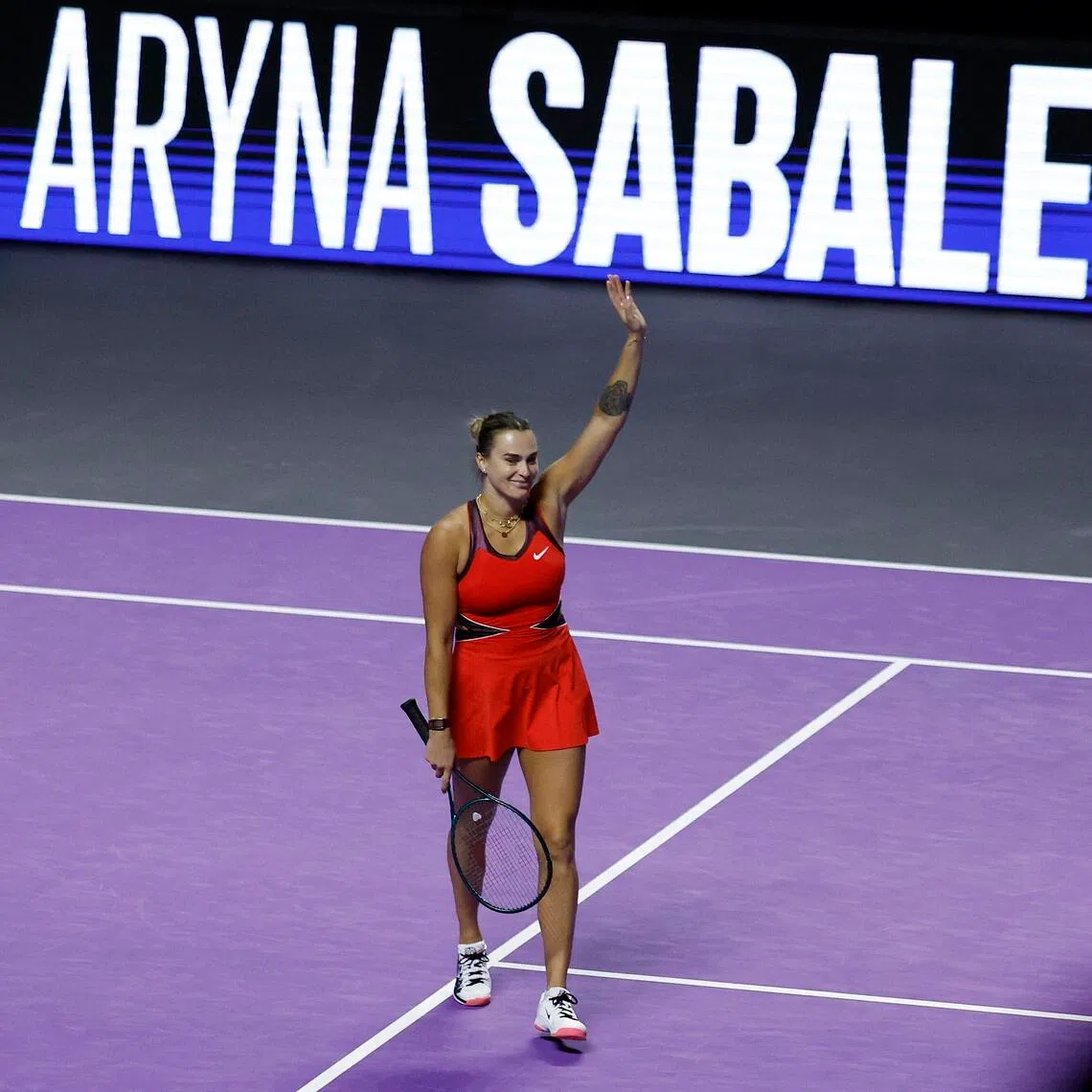 Aryna Sabalenka celebrates winning her group stage match against Coco Gauff of the US.