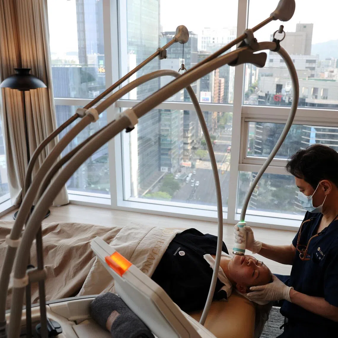 A customer receiving treatment at a skin care clinic in Seoul, South Korea.