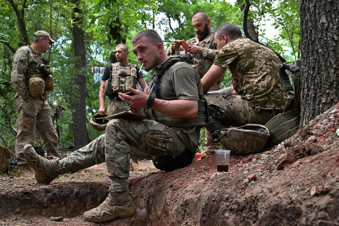 Ukrainian artillerymen take a rest near Avdiivka, in Ukraine's Donetsk region.