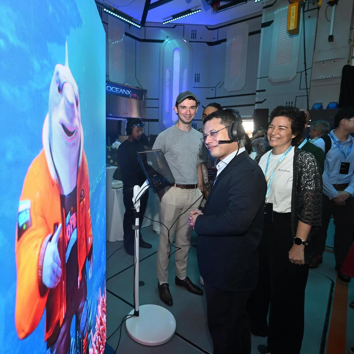 Education Minister Desmond Lee touring the exhibition inside the R/V OceanXplorer vessel on the third day of the OceanX Summit on Oct 9, 2026.