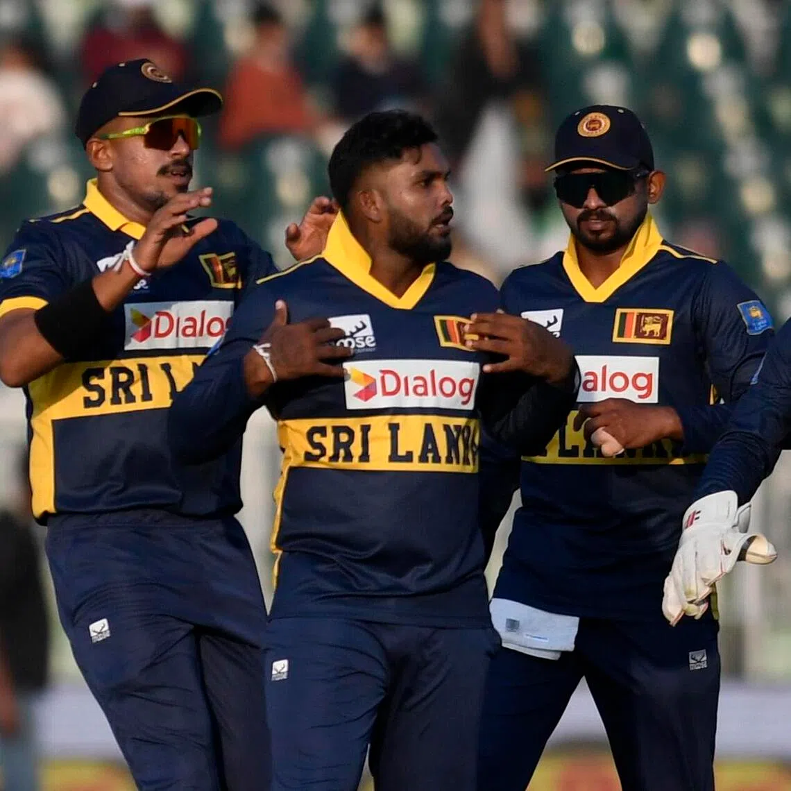 Sri Lanka's Wanindu Hasaranga (centre) and teammates celebrate after the dismissal of Pakistan's Mohammad Rizwan during the first one day international cricket match between Pakistan and Sri Lanka, in Rawalpindi, on Nov 11.