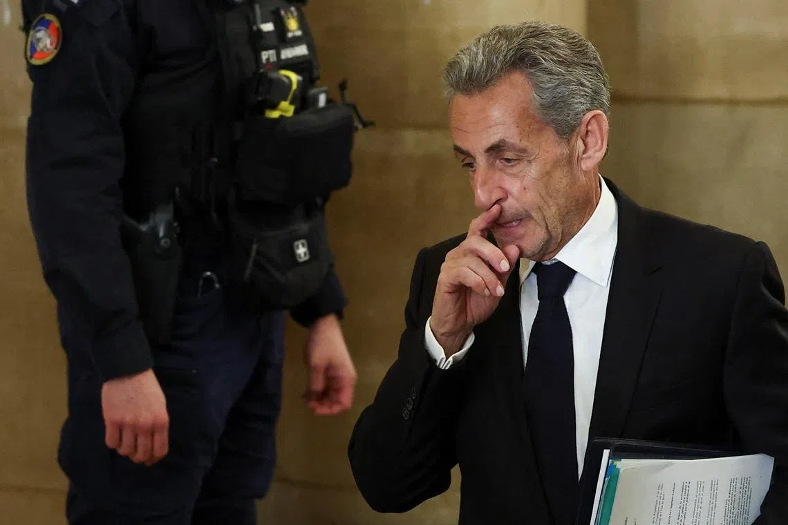 Former French President Nicolas Sarkozy arrives for the opening of the appeal in the case over Libyan campaign financing, for which he was briefly jailed last year, at Paris appeal court, France, March 16, 2026. REUTERS/Gonzalo Fuentes
