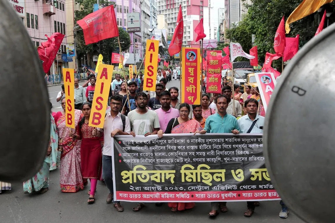Protesters march during a protest over sexual violence against women in the northeastern state of Manipur on Aug 2.