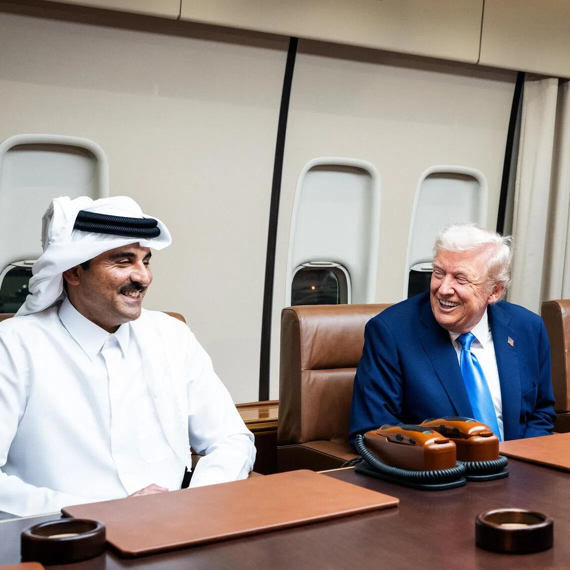 President Donald Trump (centre) meeting with Emir of Qatar Tamim bin Hamad Al Thani (left) and Qatari Prime Minister Mohammed bin Abdulrahman bin Jassim Al Thani aboard Air Force One on Oct 25, during a refuelling stop before continuing to Kuala Lumpur, Malaysia.