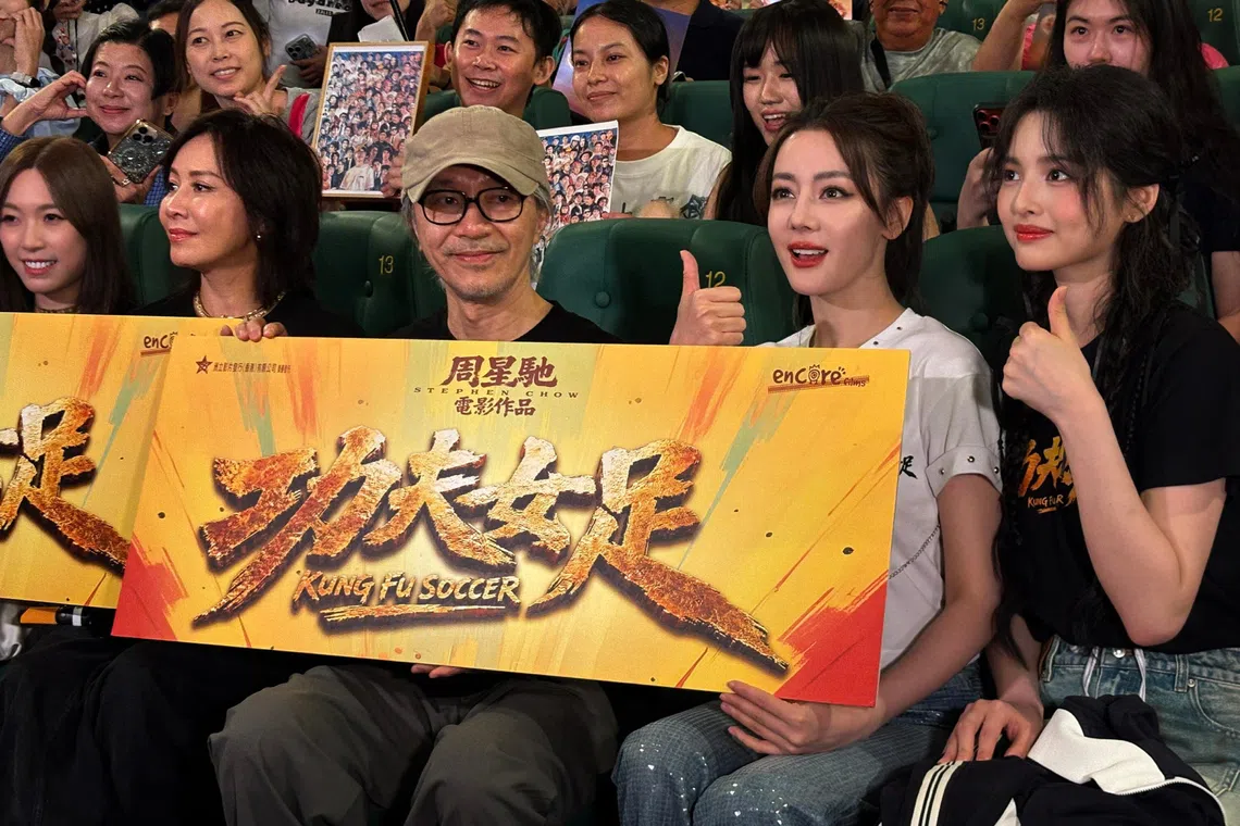 Director-actor Stephen Chow with his cast and fans at a Kung Fu Soccer screening in Hong Kong on Aug 8.
