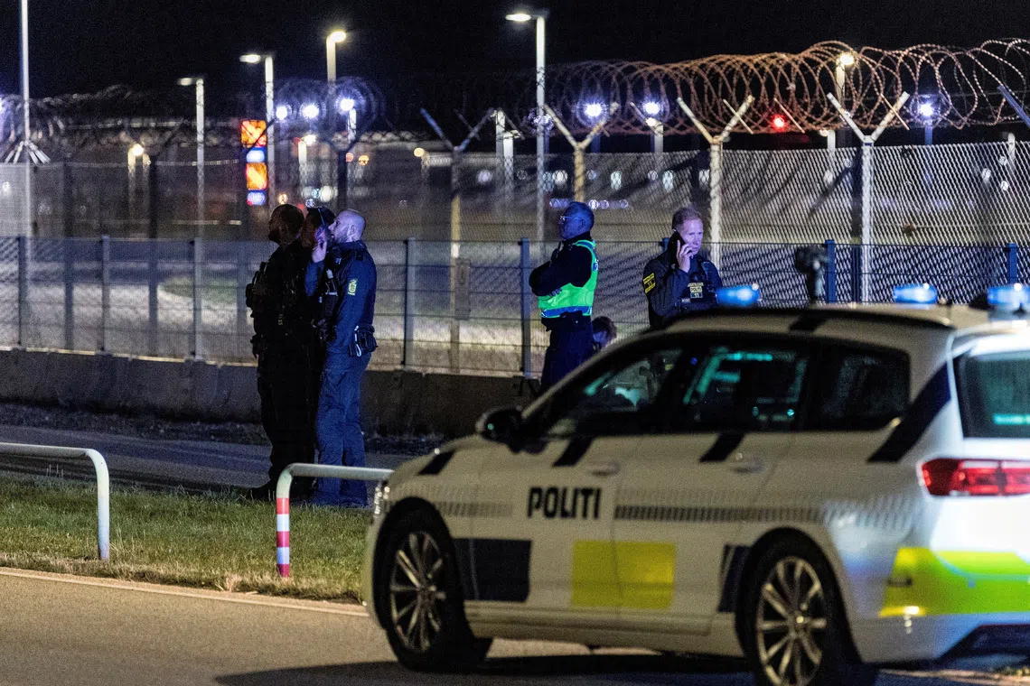 FILE PHOTO: Police officers stand guard after all traffic has been closed at the Copenhagen Airport due to drone reports in Copenhagen, Denmark September 22, 2025. Ritzau Scanpix/Steven Knap via REUTERS/ File Photo