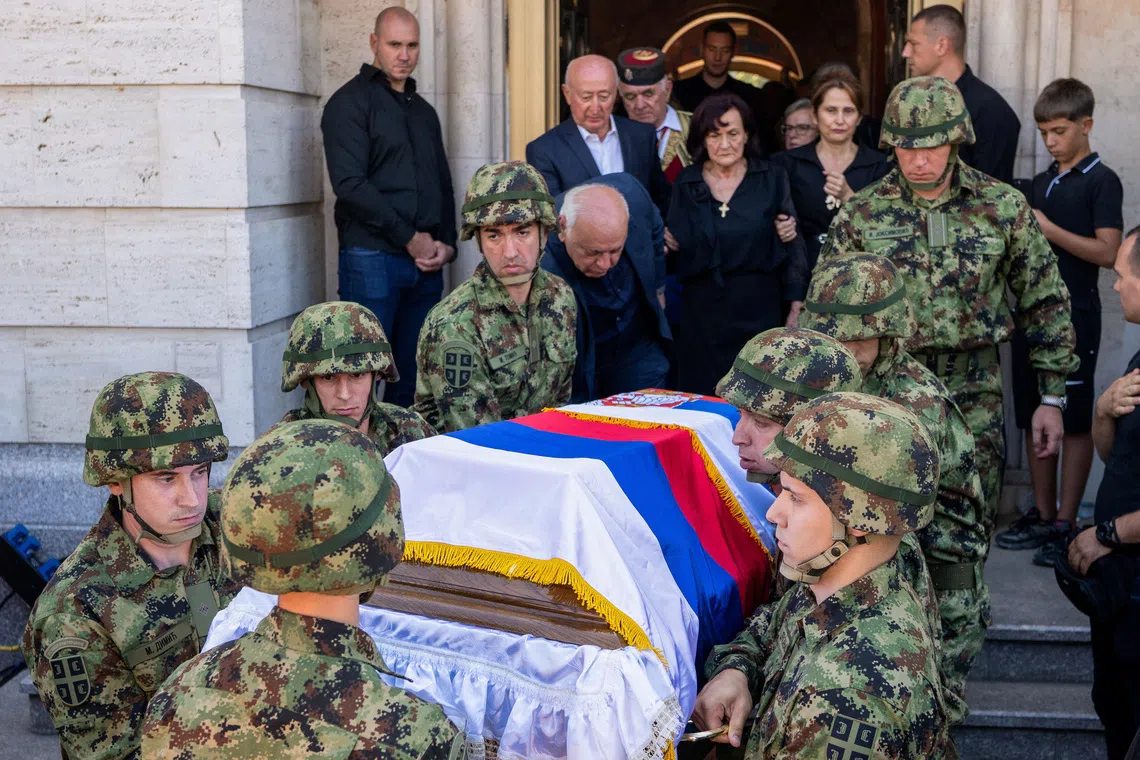 Serbian army soldiers carry the coffin of former Bosnian Serb wartime general Ratko Mladic outside the Church of St. Luke before burial, in Belgrade, Serbia, September 7, 2026. REUTERS/Uros Arsic