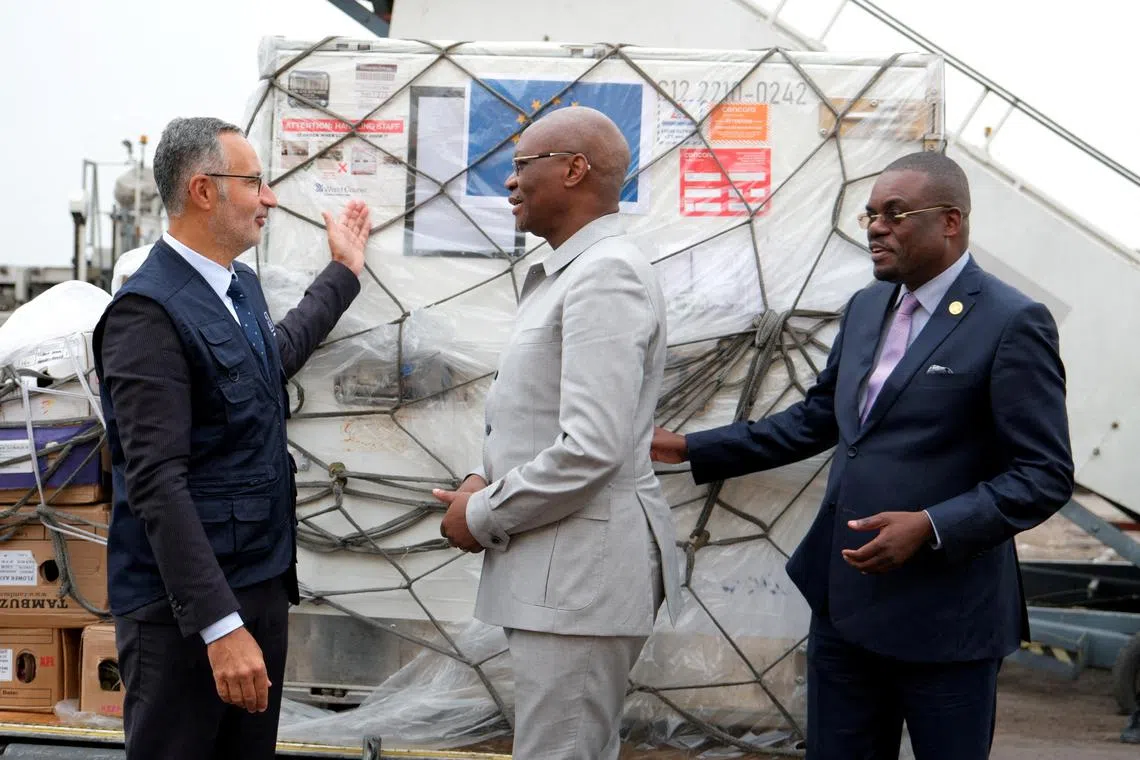 FILE PHOTO: Laurent Muschel, HERA Director General, presents mpox vaccines to the Democratic Republic of Congo's Health Minister Samuel Roger Kamba Mulamba as first batches arrive in the country, while Jean Kaseya, Africa CDC Director General, looks on, at N'Djili International Airport in Kinshasa, Democratic Republic of Congo September 5, 2024. REUTERS/Justin Makangara/File Photo