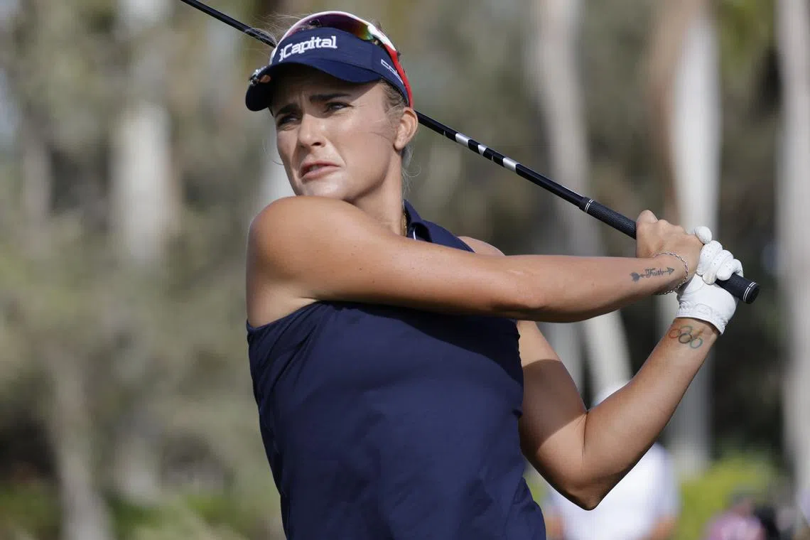 FILE PHOTO: Dec 15, 2024; Naples, Florida, [USA];  Lexi Thompson hits her drive off the ninth tee during final round play of the Grant Thornton Invitational at Tiburón Golf Club. Mandatory Credit: Reinhold Matay-Imagn Images