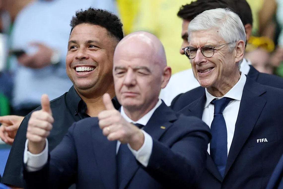 (From left) Former Brazil striker Ronaldo, FIFA president Gianni Infantino and FIFA chief of global football development Arsene Wenger during the World Cup match between Scotland and Brazil on June 24.