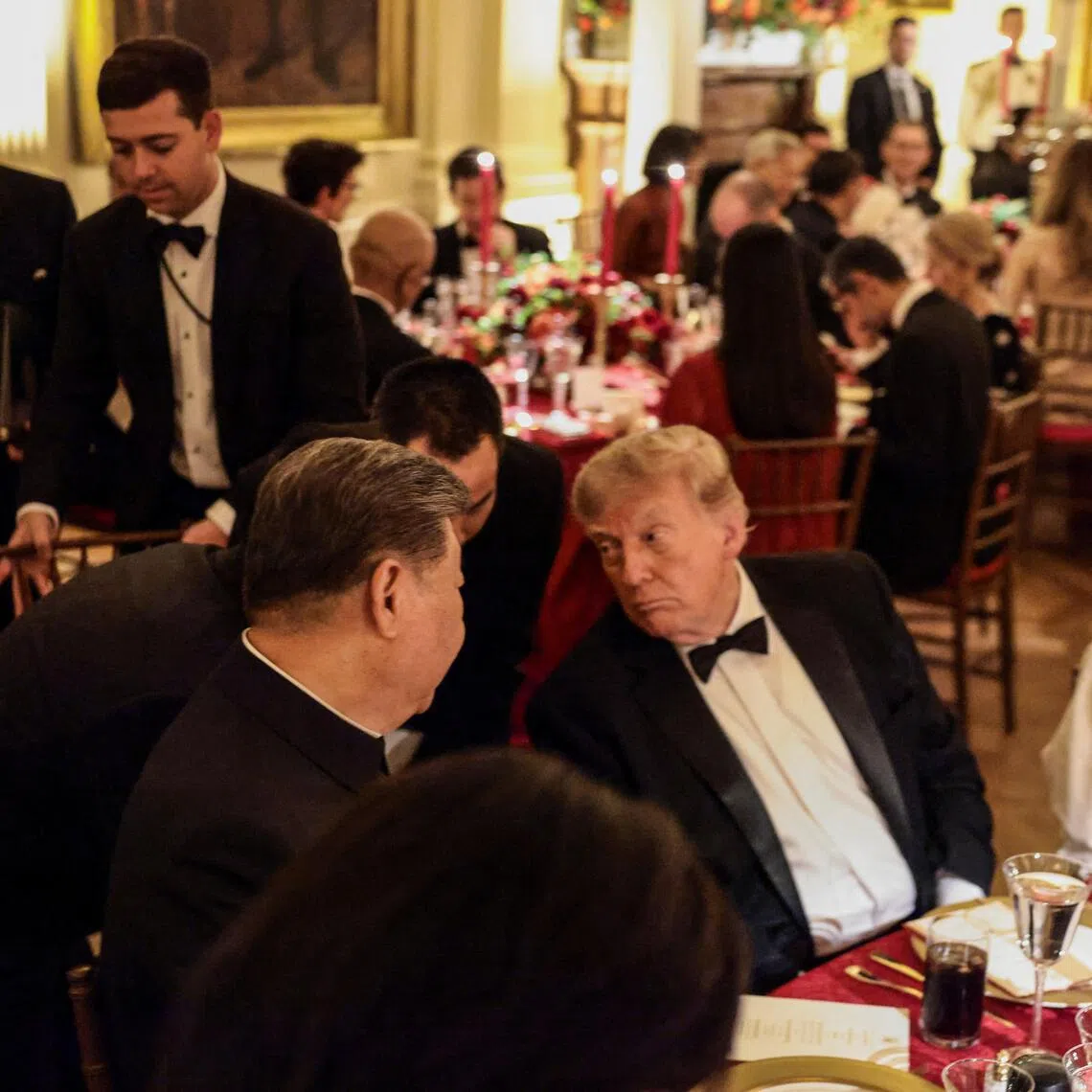 Chinese President Xi Jinping and US President Donald Trump speak during a state dinner at the White House in Washington DC., US, on Sept 24.