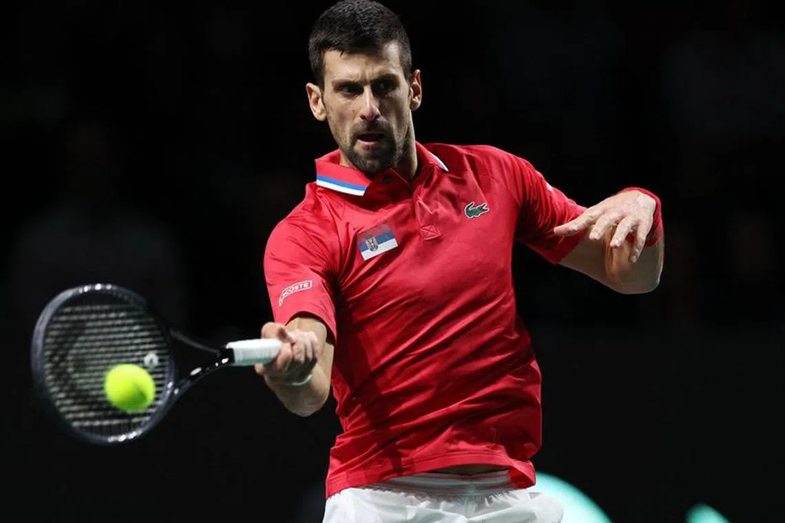 FILE PHOTO: Tennis - Davis Cup Finals - Semi Final - Serbia v Italy - Palacio de deportes Martin Carpena, Malaga, Spain - November 25, 2023  Serbia's Novak Djokovic in action during his match against Italy's Jannik Sinner REUTERS/Violeta Santos Moura/File Photo