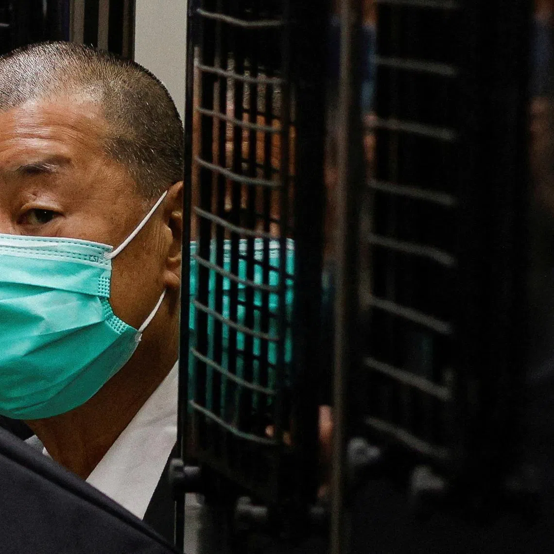 FILE PHOTO: FILE PHOTO: FILE PHOTO: Media mogul Jimmy Lai, founder of Apple Daily, arrives the Court of Final Appeal by prison van in Hong Kong, China February 9, 2021. REUTERS/Tyrone Siu/File Photo/File Photo/File Photo