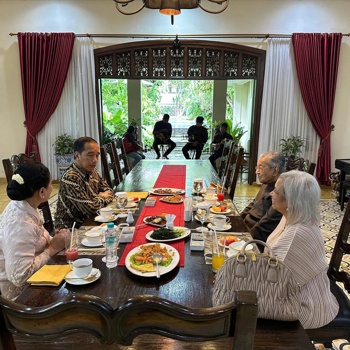 Former Indonesia president Joko Widodo (second from L) and his wife Iriana (L), hosting lunch for former Malaysian prime minister Tun Mahathir Mohamad (second from R) and his daughter Marina (R), at Joko's home on Feb 26, 2025.