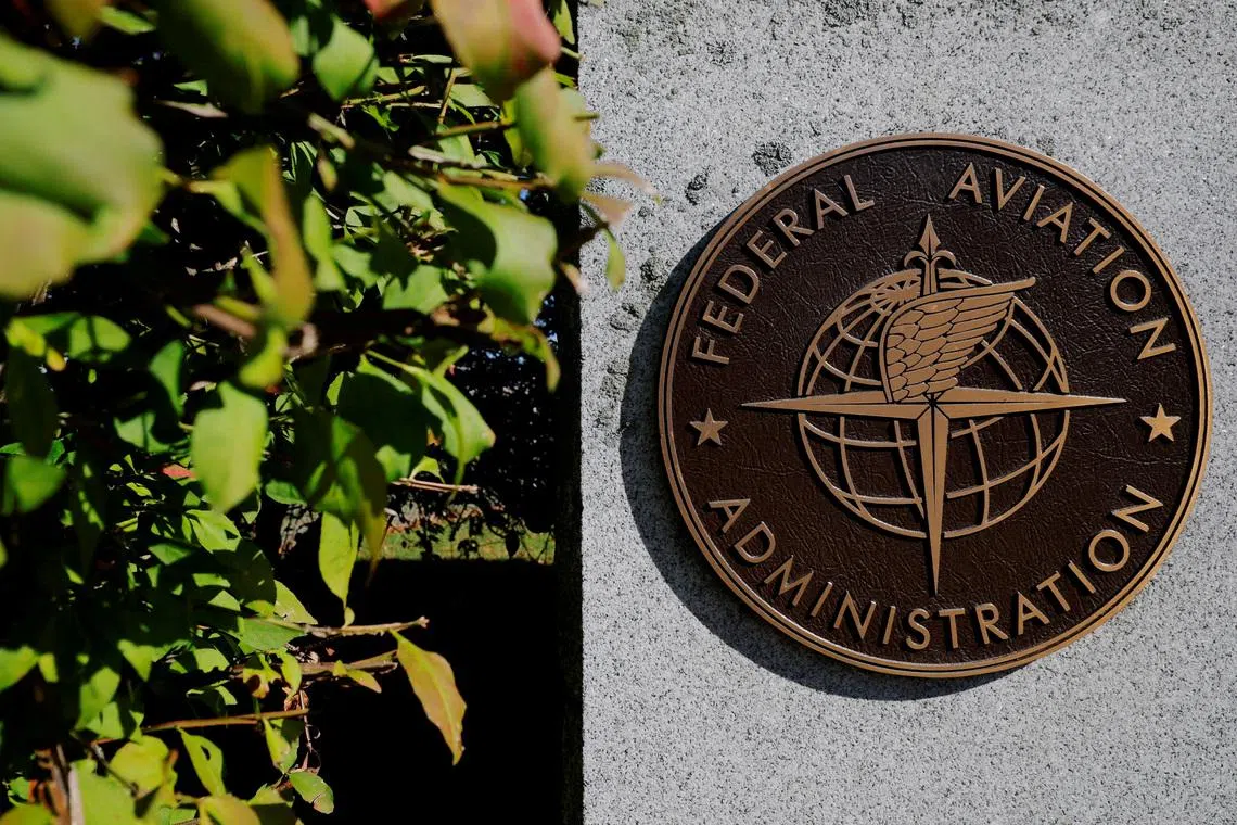 FILE PHOTO: A sign marks the Federal Aviation Administration's (FAA) Boston Air Route Traffic Control Center, where air traffic controllers continue to work during the U.S. government shutdown, in Nashua, New Hampshire, U.S., October 9, 2025.   REUTERS/Brian Snyder/File Photo